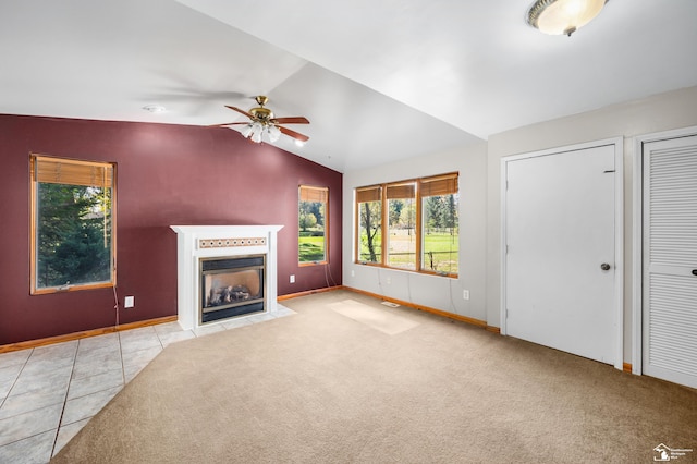 unfurnished living room with ceiling fan, light carpet, and vaulted ceiling