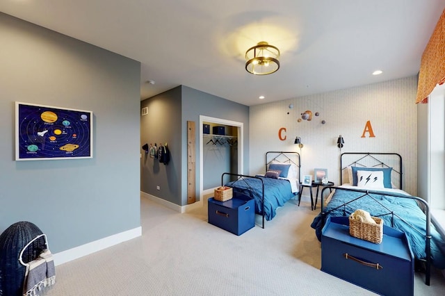 carpeted bedroom featuring a closet