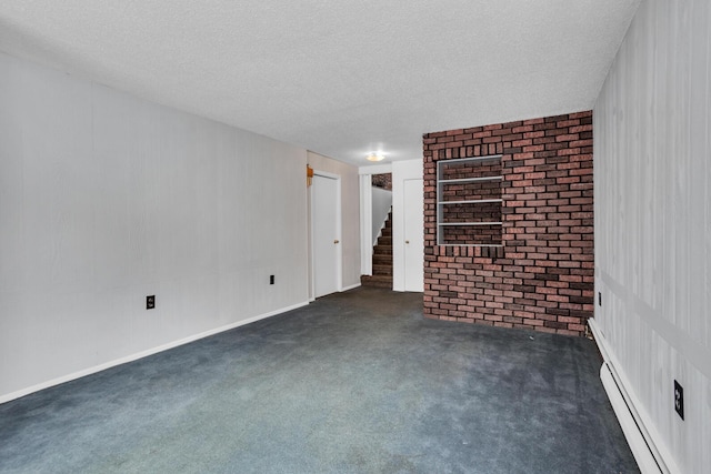 unfurnished room featuring built in features, a baseboard radiator, a textured ceiling, and dark carpet