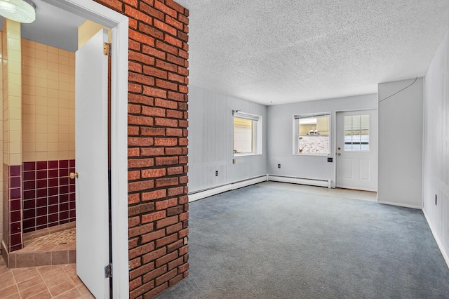 unfurnished living room with carpet floors, a textured ceiling, and baseboard heating