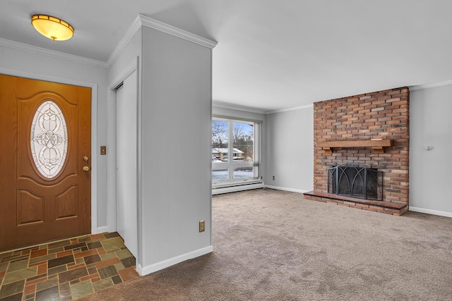 entrance foyer with dark colored carpet, a baseboard heating unit, a fireplace, and ornamental molding