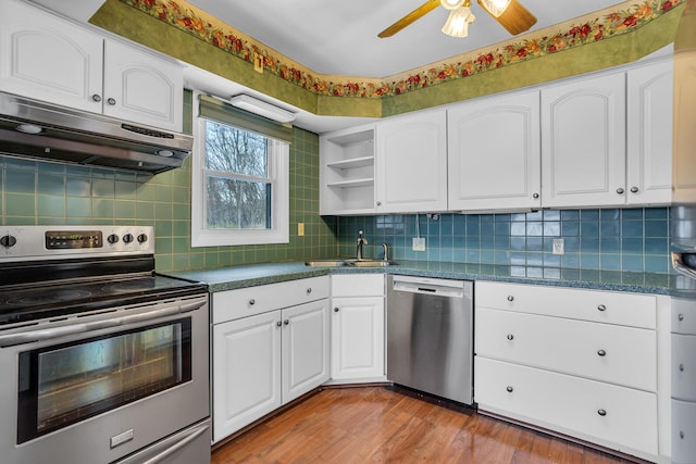 kitchen featuring sink, stainless steel appliances, ventilation hood, white cabinets, and light wood-type flooring