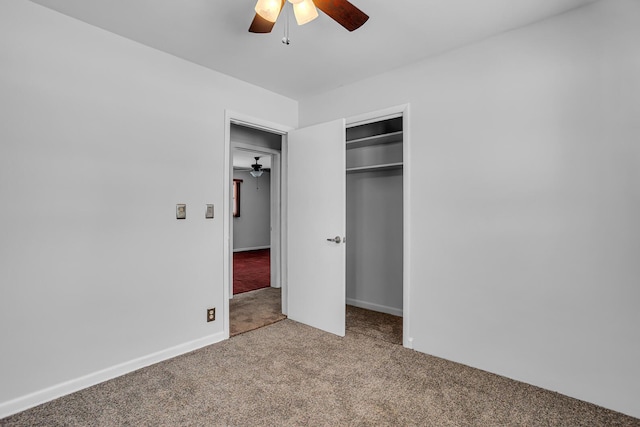 unfurnished bedroom with carpet flooring, ceiling fan, and a closet