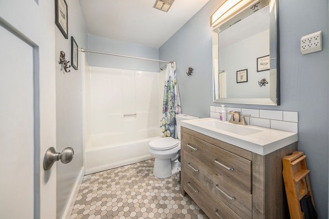 full bathroom featuring vanity, shower / bath combination with curtain, tile patterned flooring, toilet, and tasteful backsplash