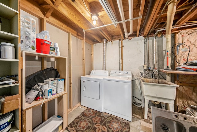 laundry area with washing machine and dryer and sink