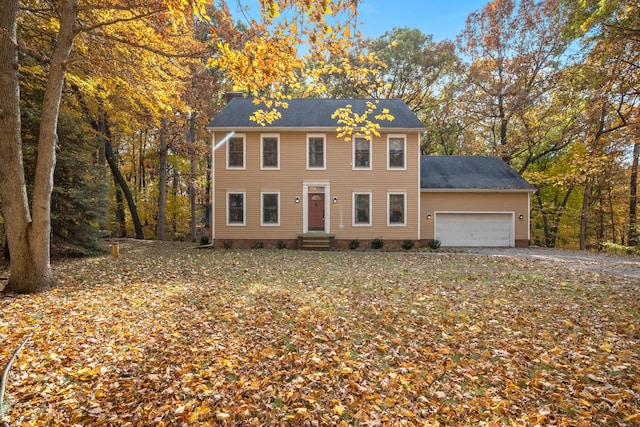 colonial-style house featuring a garage