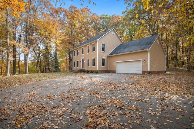 view of side of home featuring a garage