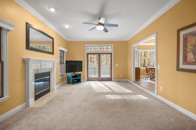 unfurnished living room with a high end fireplace, light colored carpet, and ornamental molding