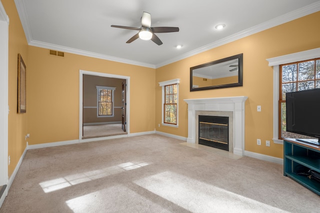 unfurnished living room featuring light carpet, ceiling fan, crown molding, and a premium fireplace