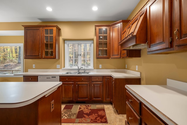 kitchen with dishwasher, light tile patterned floors, and sink