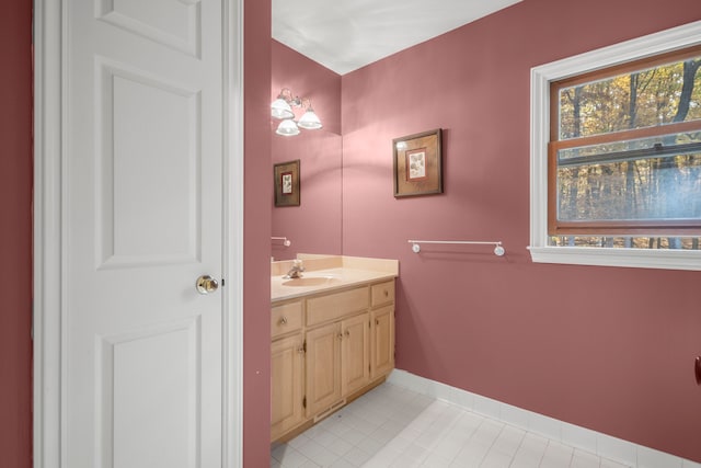 bathroom featuring tile patterned flooring and vanity