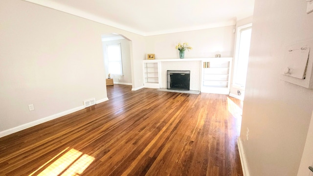 unfurnished living room featuring hardwood / wood-style flooring