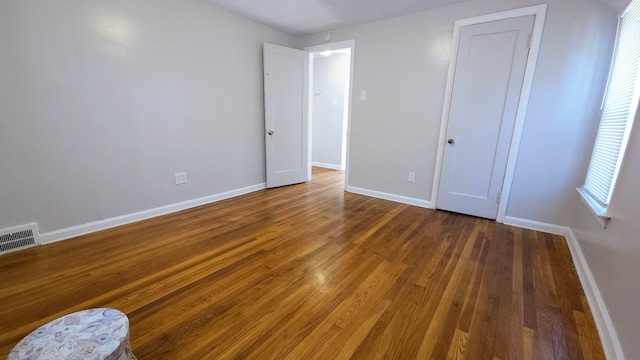 unfurnished bedroom featuring wood-type flooring