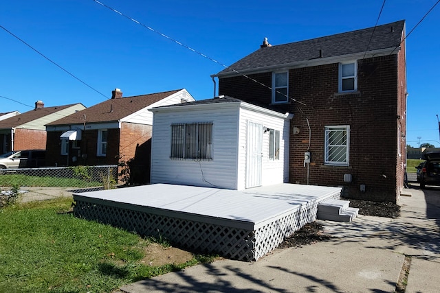 back of property featuring a deck