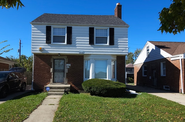 view of front facade featuring a front yard