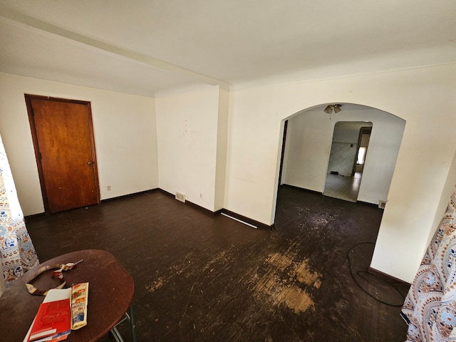 spare room with dark hardwood / wood-style flooring