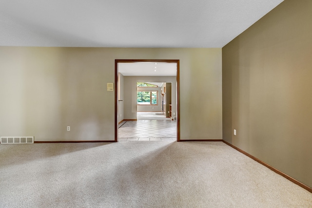 empty room featuring light colored carpet