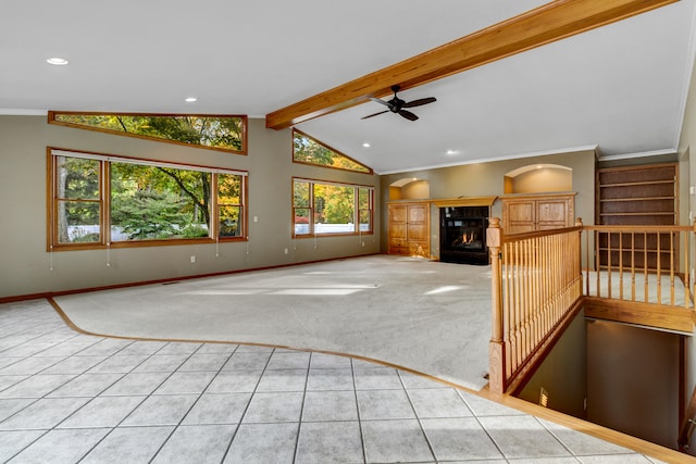 unfurnished living room featuring lofted ceiling with beams, ceiling fan, crown molding, and light carpet