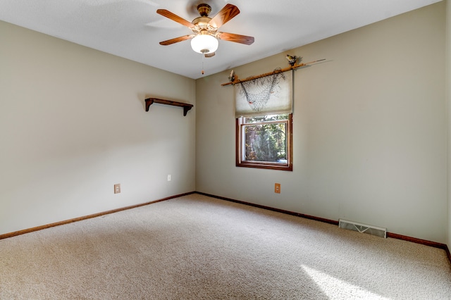 carpeted empty room with ceiling fan