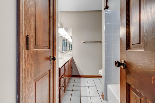 bathroom featuring tile patterned flooring, vanity, and toilet