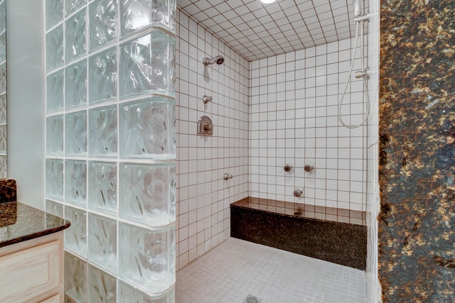 bathroom featuring a tile shower