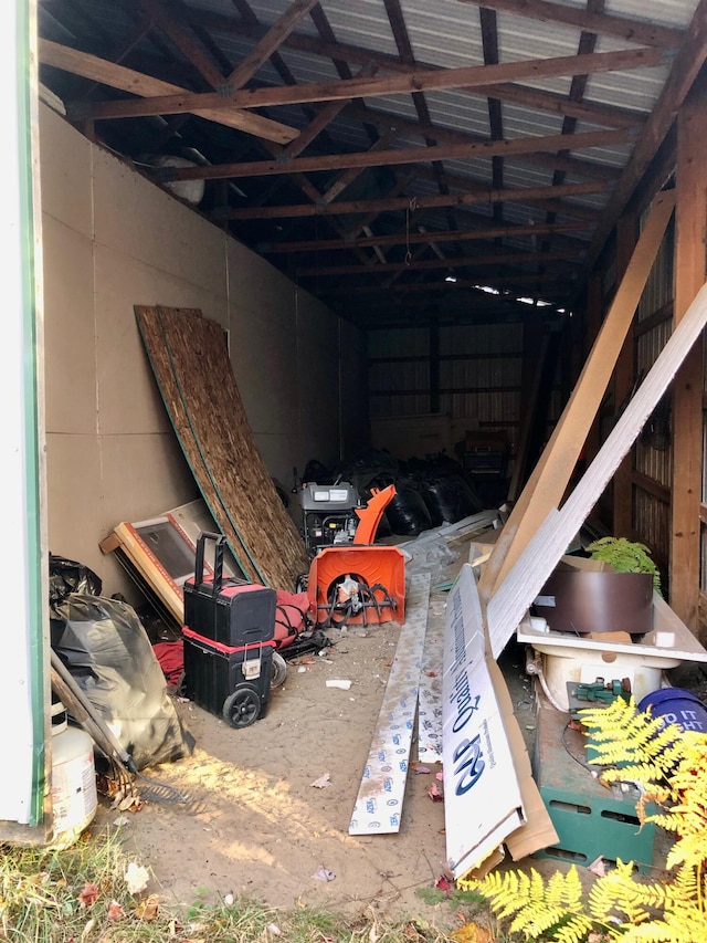 miscellaneous room with lofted ceiling