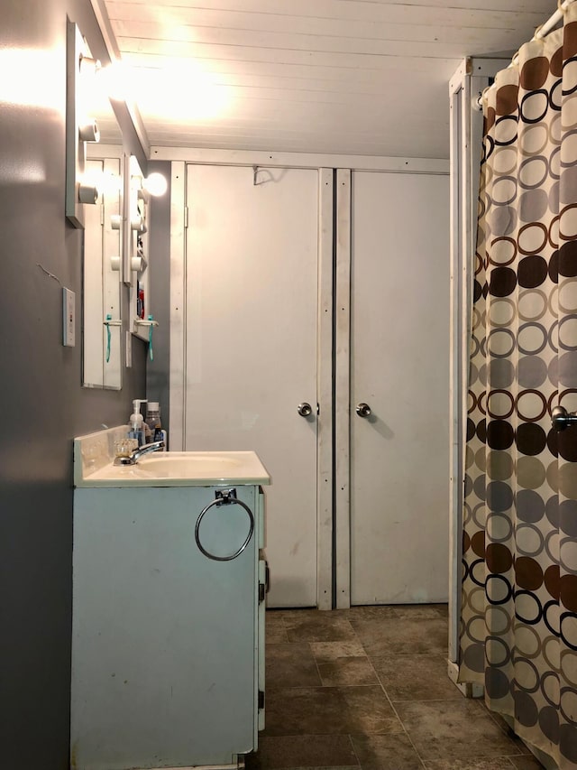 bathroom featuring vanity and wood ceiling