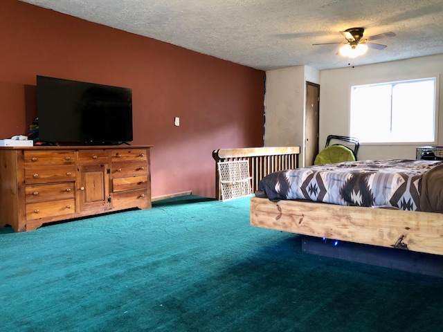 carpeted bedroom with ceiling fan and a textured ceiling