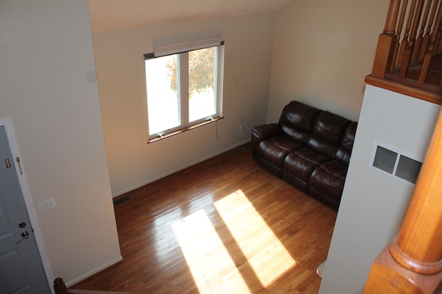 living room with dark hardwood / wood-style flooring