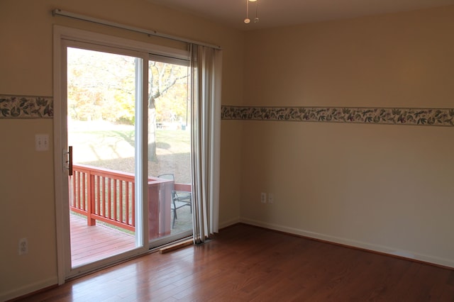 spare room featuring hardwood / wood-style floors