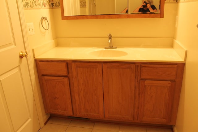 bathroom with tile patterned floors and vanity