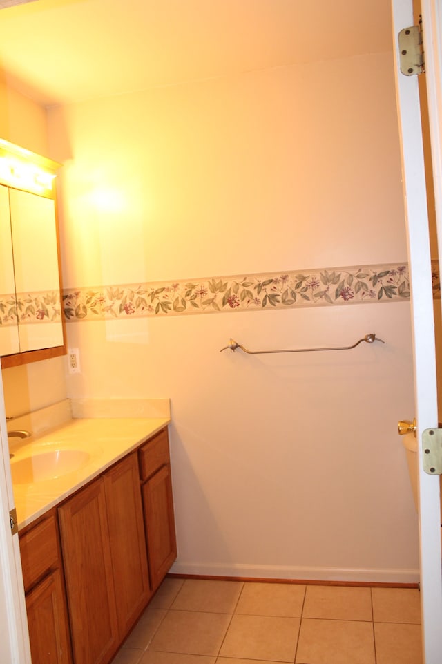 bathroom with tile patterned floors and vanity