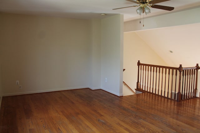 spare room featuring ceiling fan and dark hardwood / wood-style floors