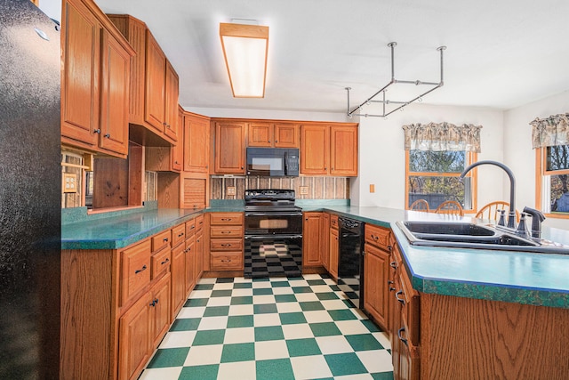 kitchen featuring sink and black appliances