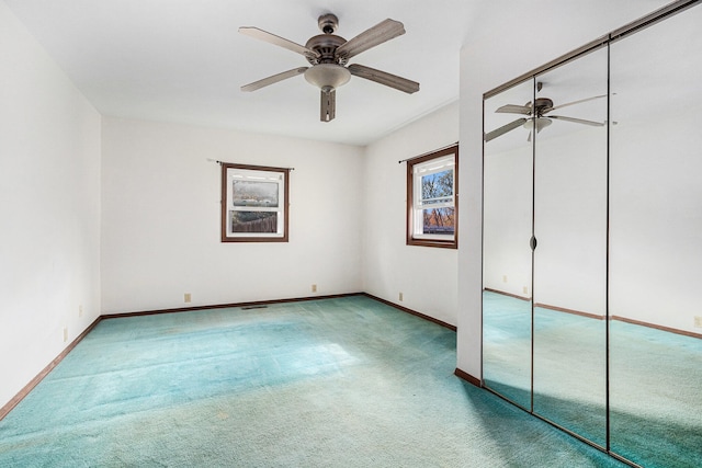 unfurnished bedroom with carpet floors, a closet, and ceiling fan