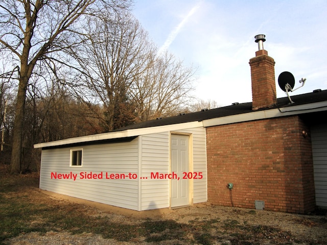 view of side of property featuring a chimney