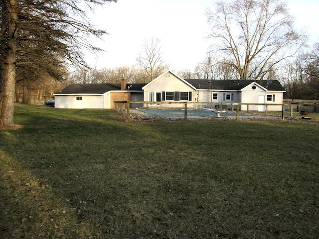 view of yard with a fenced in pool