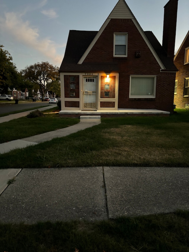 view of front of house with a lawn