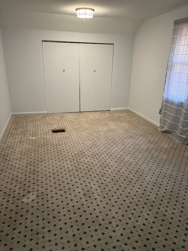 unfurnished bedroom featuring light colored carpet