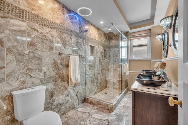 bathroom with vanity, an enclosed shower, tile walls, and toilet