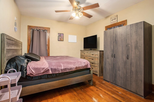 bedroom featuring hardwood / wood-style floors and ceiling fan