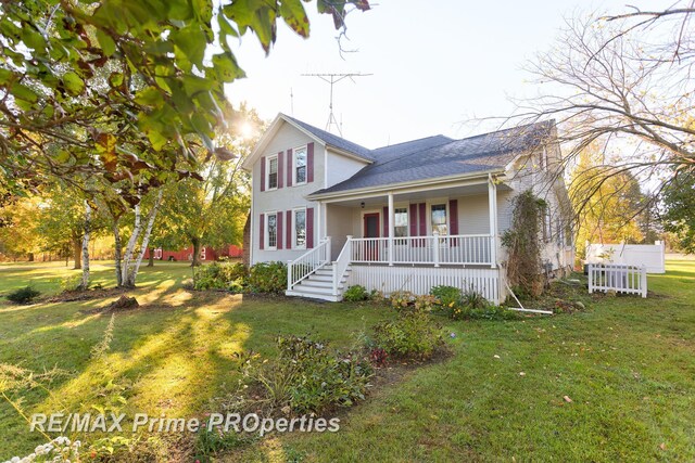 10300 Lange Rd, Birch Run, MI 48415 - view of front of property with covered porch, a front lawn, and a shingled roof