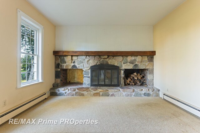 10300 Lange Rd, Birch Run, MI 48415 - detailed view of a baseboard radiator, a stone fireplace, and carpet