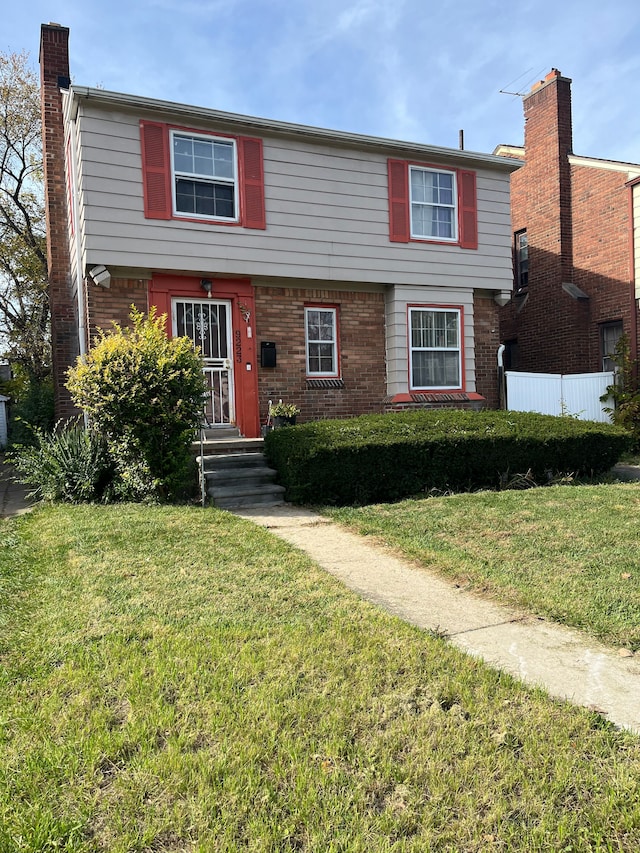 view of front of property with a front lawn