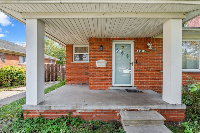 property entrance featuring a porch