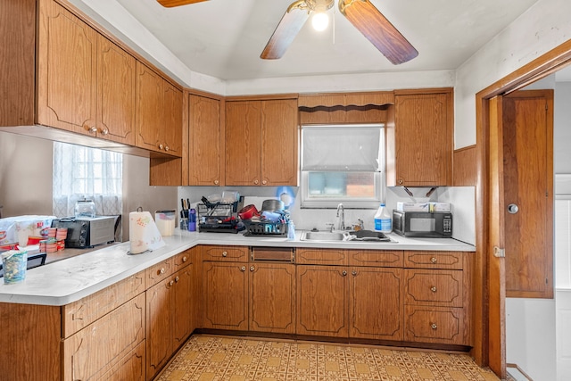 kitchen with ceiling fan and sink