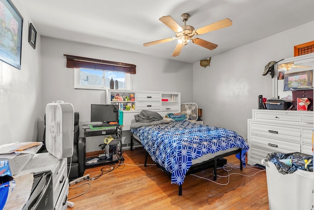 bedroom with ceiling fan and light wood-type flooring