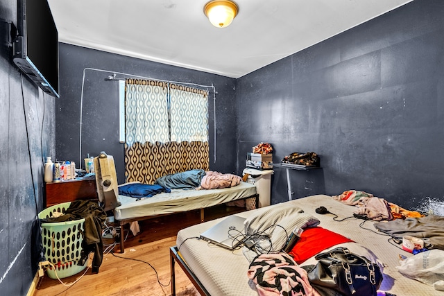 bedroom with wood-type flooring