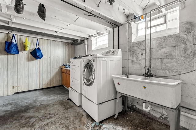 washroom featuring separate washer and dryer and sink