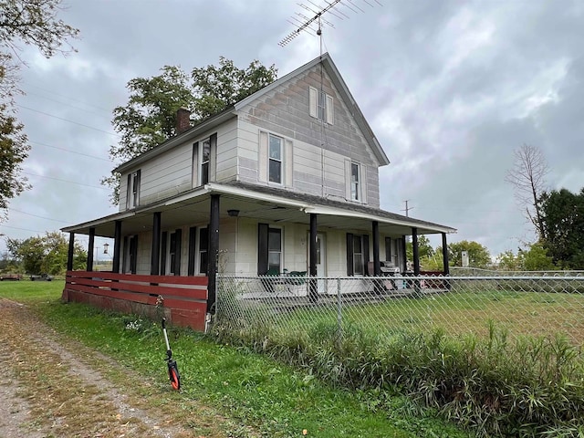 country-style home with covered porch